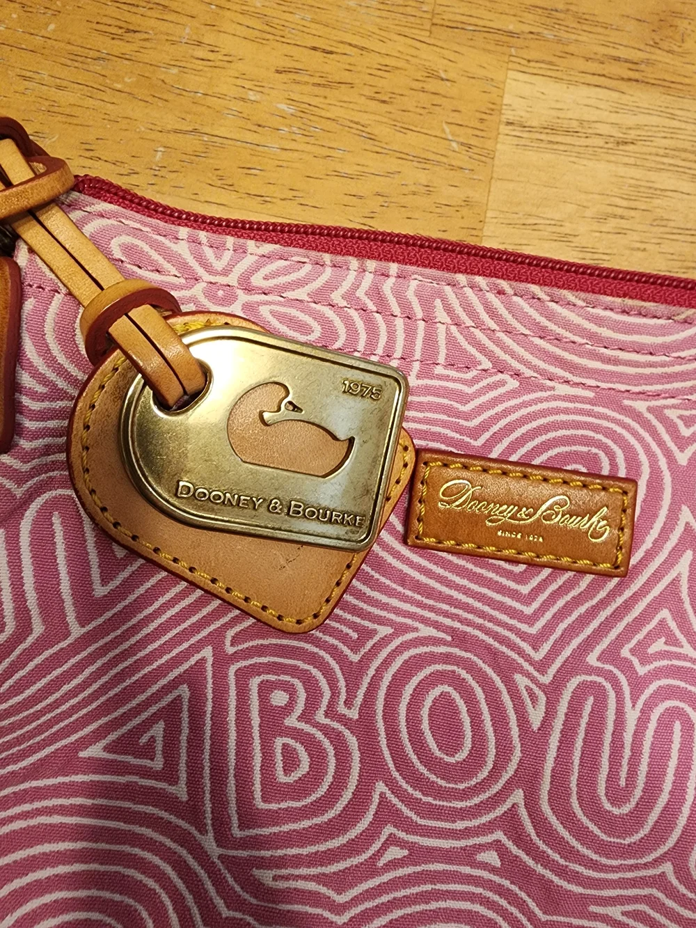 Dooney & Bourke pink doodle swirl canvas mini shoulder bag featuring tan leather